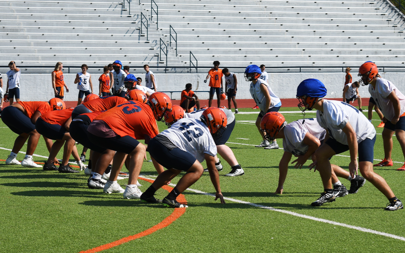 The Raiders get in their stances and wait for the snap. LANG STOREY/Staff