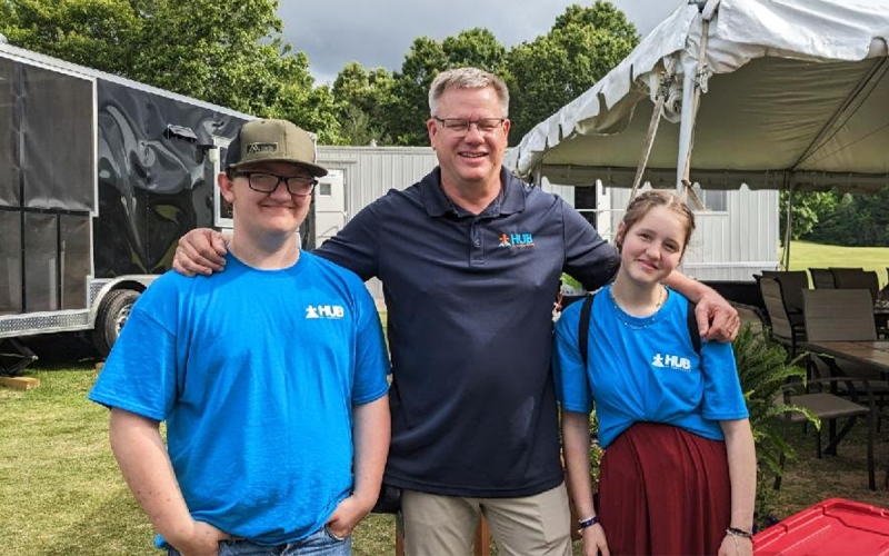 Todd Colwell (center) attends the second Annual HUB of Habersham Golf Tournament at The Orchard Golf and Country Club. The game is sponsored by local businesses, and players consisted of local community members. Left to right is Hayden Hallford and Josy Redmann. SUBMITTED