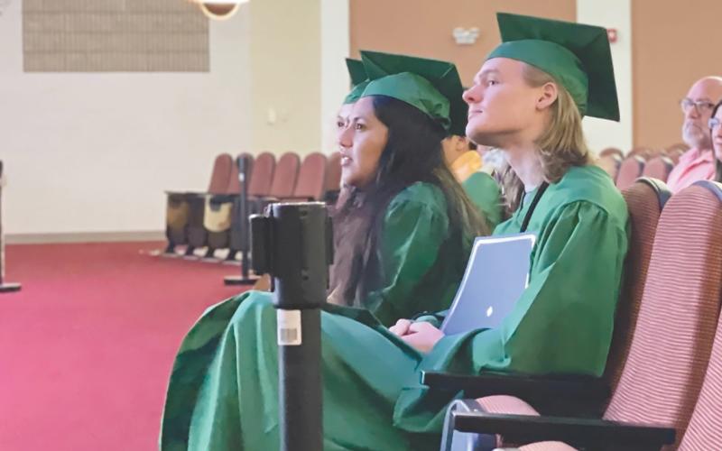 Graduates of Mountain Ed listen to a speaker at the ceremonies earlier this year. The specialized school was able to get a reprieve from the Georgia Assembly to continue serving  students who require an alternative to regular school education schedule. FILE