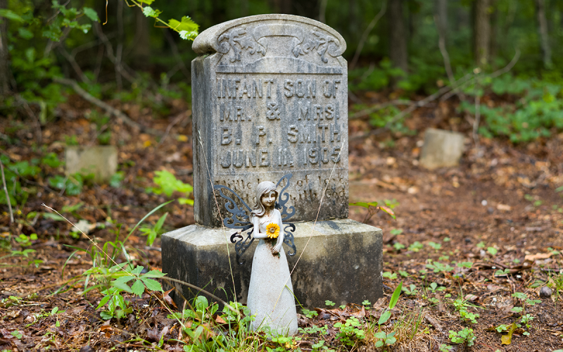 The infant son of Mr. and Mrs. B.P. Smith also has an angel figurine standing watch in front of his headstone in the the Warren-Martin/Smith Family Cemetery in Cornelia. ZACH TAYLOR/Special