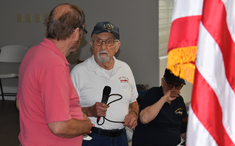 World War II veteran Hank Sawicki (right) talks with Ed Vaughn during his  presentation at the Veterans &amp; Patriots breakfast on Saturday morning. MATTHEW OSBORNE/Staff