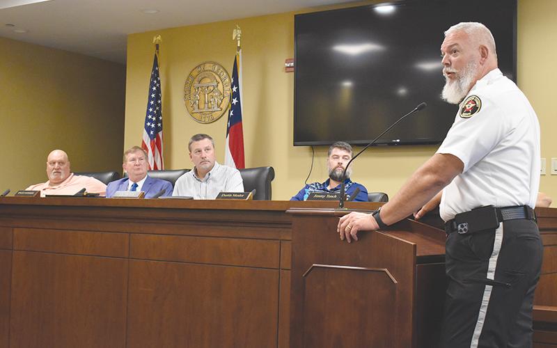 Sheriff Joey Terrell (right) told the county commissioners Monday that he means business when it comes to making Highway 365 safer.