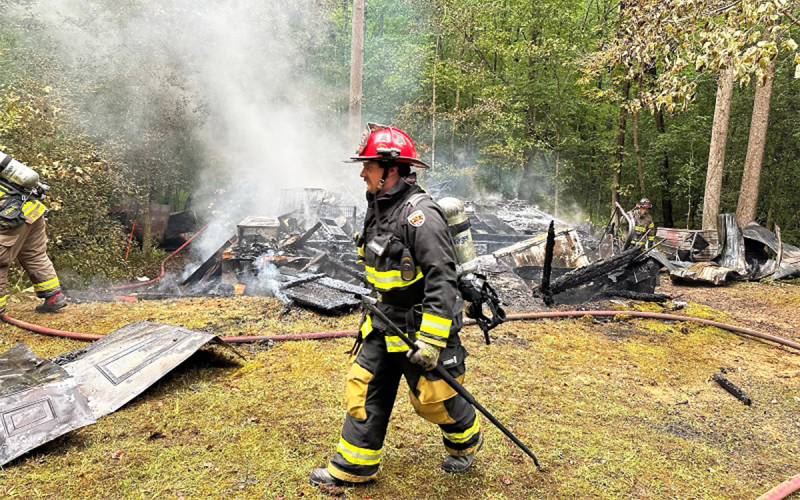 Firefighters move toward the incident commander at the scene of Monday’s fire on Hosanna Lane outside Cornelia. HABERSHAM COUNTY/Submitted