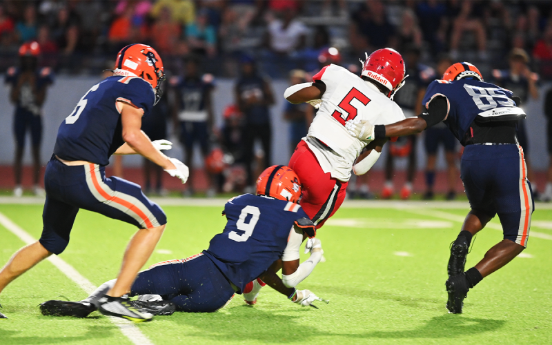 Habersham Central defenders Jonah Wilson (6), Somdee Satiphone Jr. (9) and Sonny Satiphone (85) surround Stephens County’s Javin Gordon during Friday’s game. TOM ASKEW/Special