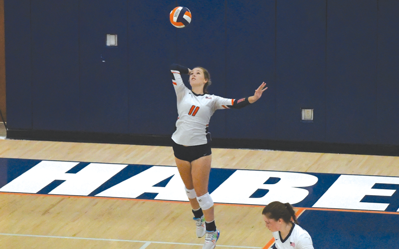 Habersham Central’s Jayden Jarrett serves during an earlier home match. LANG STOREY/Staff