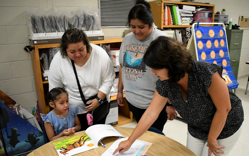 Cornelia Elementary student Jerusa Cruz gets to ask questions with mother Clara, sister Merary and kindergarten teacher Brenda McAllister. JOHN DILLS/Staff