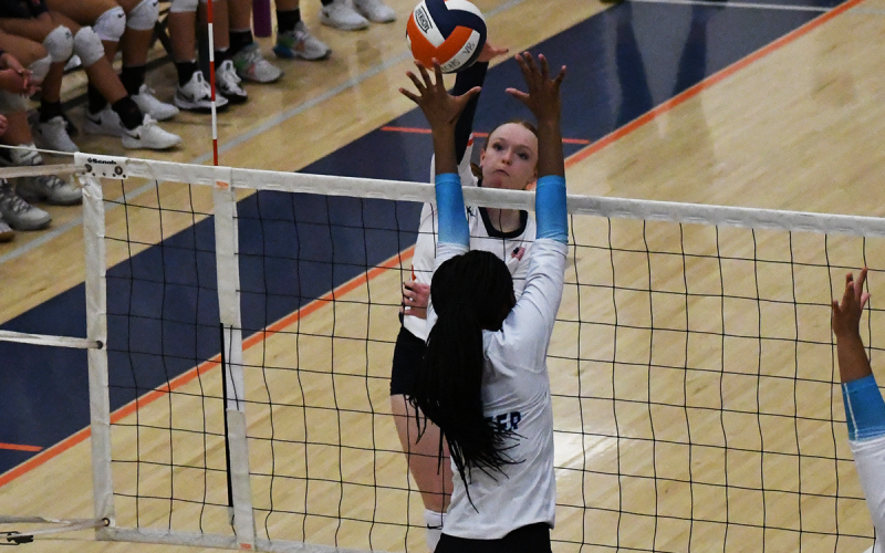 Habersham Central’s Katelynn LoBuono looks to spike the ball through the block of a Seckinger player during Thursday’s exhibition. LANG STOREY/Staff