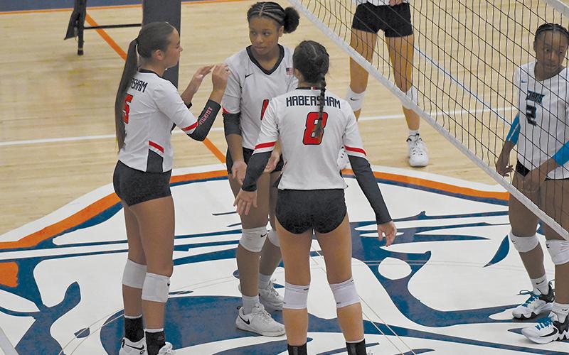 The Lady Raiders talk strategy during their preseason match last week.