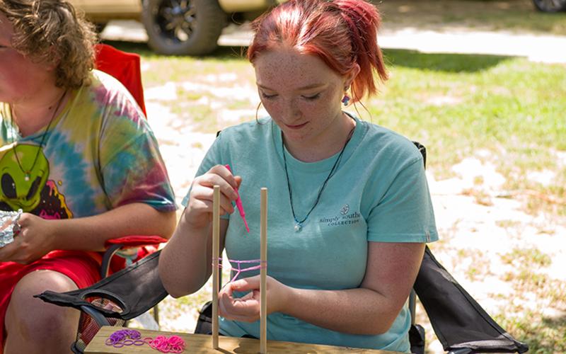 Hayley Hill made loom bracelets to sell at the event in Clarkesville on Saturday. ZACH TAYLOR/Special