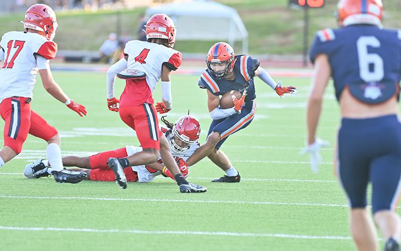 Habersham Central’s Landyn Savage avoids Stephens County tacklers during the season opener. TOM ASKEW/Special