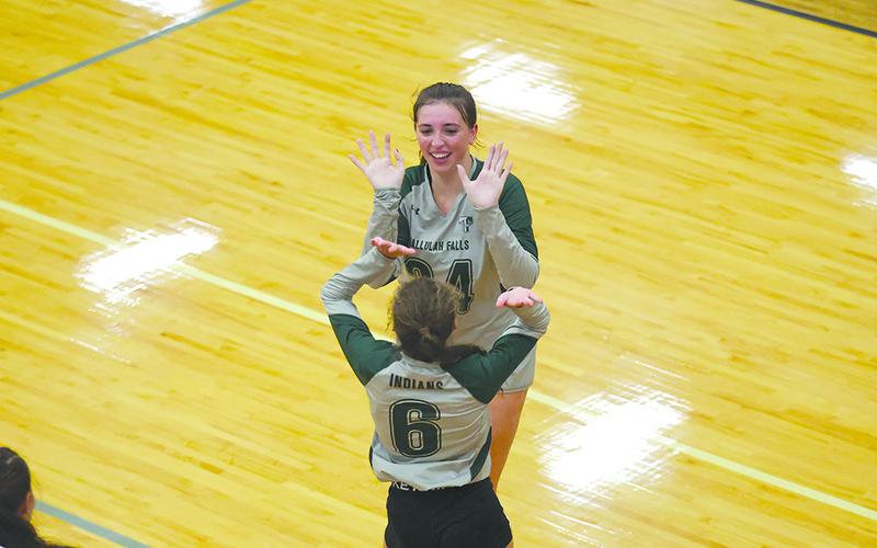 Tallulah Falls’ Addy McCoy (top) celebrates a point with teammate Julianne Shirley earlier this season. AUSTIN POFFENBERGER/Special
