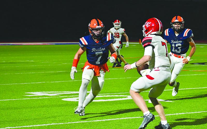 Habersham Central’s Braden Henslee sizes up Forsyth Central’s Drew Reid as he pursues during last Friday’s game. LANG STOREY/Staff