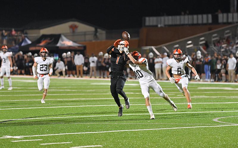 Raiders defender Hayden Gailey breaks up a pass against Lanier. TOM ASKEW/Special