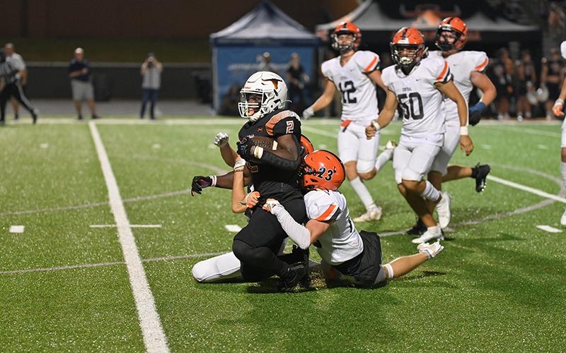 Habersham Central’s Carter Barrett brings down Lanier’s Tayo Ashadele last Friday. TOM ASKEW/Special