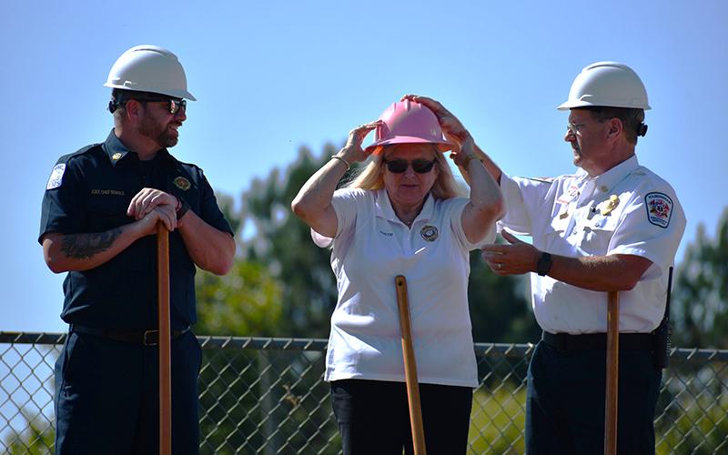 Assistant Chief of Baldwin Fire Department Shawn Benfield, 911 Director Lynn Smith, and Emergency Medical Services Director Jeff Adams prepare to break ground for the new public safety radio system in Habersham County on Tuesday. JULIANNE AKERS/Staff