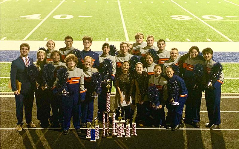 The Band of Blue stands with their trophies. Submitted