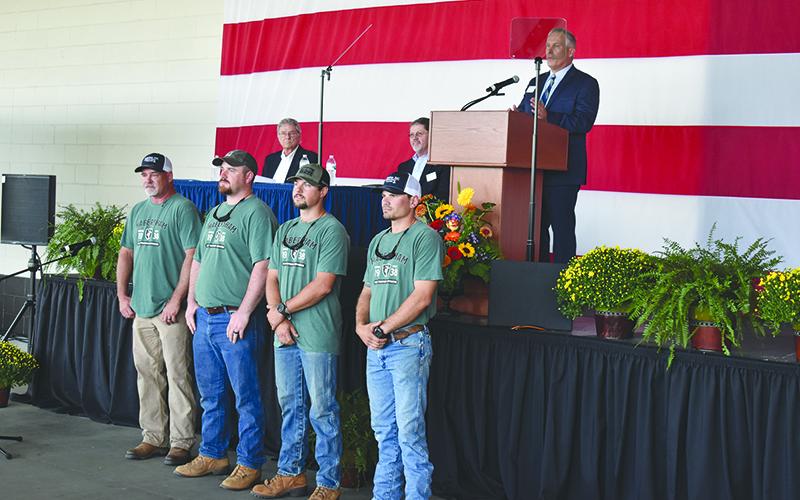 Habersham EMC and CEO Bryan Ferguson (on stage) recognized its lineman who were champions of last year’s International Lineman’s Rodeo, including coach Chris Chapman, Tucker Dyer, Robert Morris and Dillon Welborn. MATTHEW OSBORNE/Staff