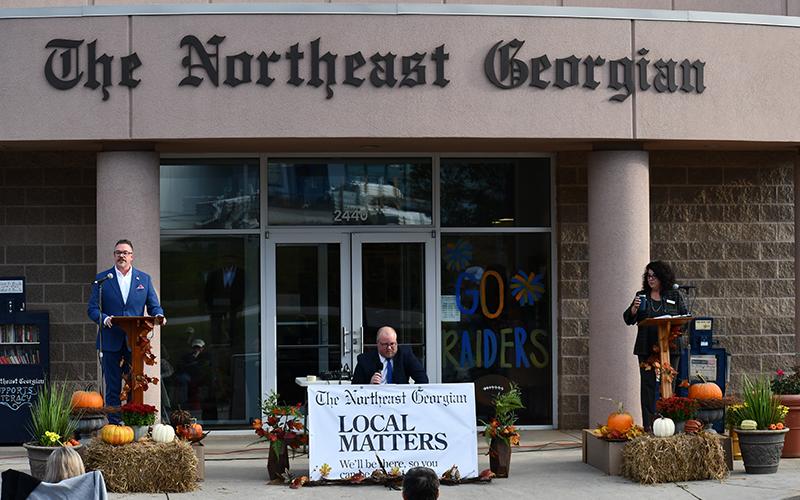 Baldwin mayoral candidates Tom Whitney (left) and Stephanie Almagno (right) listen to  questions from The Northeast Georgian editor Matthew Osborne during Tuesday’s debate. JULIANNE AKERS/Staff