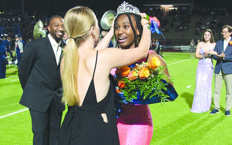 Habersham Central homecoming queen Amayah Dooley can hardly believe it as she is crowned Friday night by last year’s queen, Haley Viera. TOM ASKEW/Special