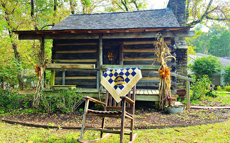 The Historic Mauldin House is shown with a one-of-a-kind Clarkesville  Bicentennial quilt which will be auctioned at the event this weekend. FILE