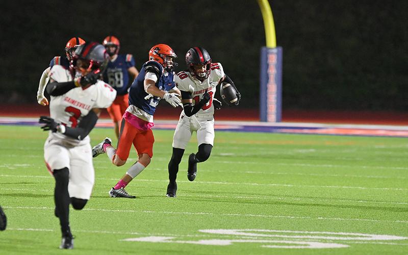 Habersham Central’s Landyn Savage looks to bring down Gainesville’s Eric Hart. TOM ASKEW/Special