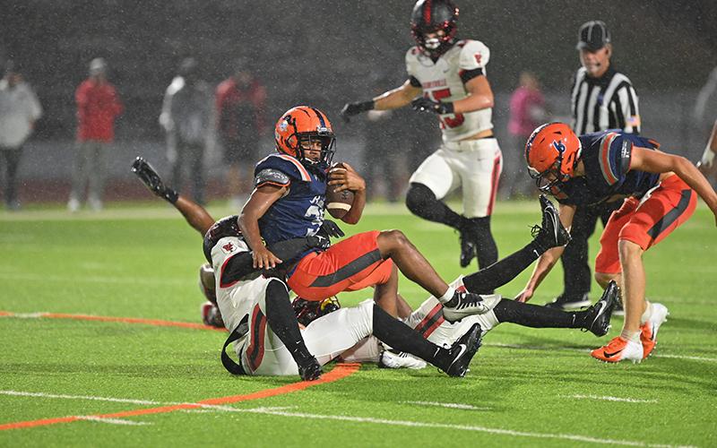 Habersham’s Donnie Warren rolls over top of a tackler during his 115-yard game. TOM ASKEW/Special