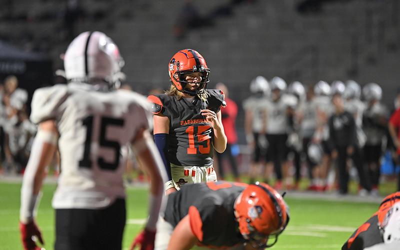 Habersham Central quarterback DJ Pass looks over the defense just before the snap during the Raiders’ win over Jackson County. TOM ASKEW/Special