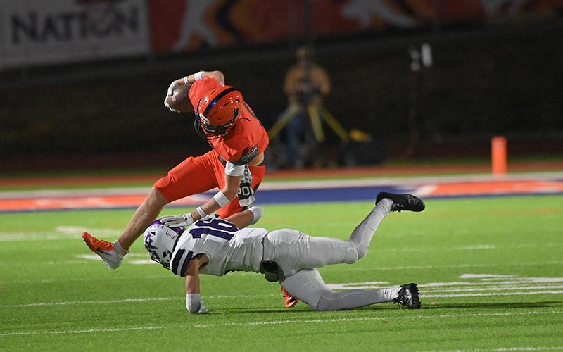 Habersham Central’s Jonah Wilson looks to break a tackle by North Forsyth defender Parker Smaltz during Friday’s home finale. TOM ASKEW/Special