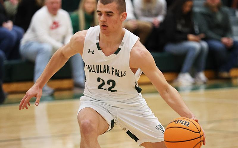 Zakhar Valasiuk dribbles down the court. FILE