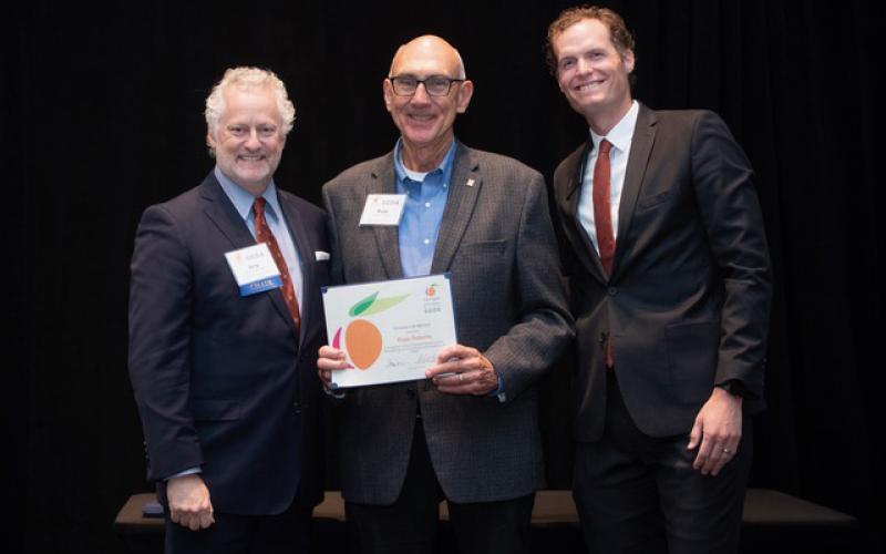 Rope Roberts (middle) receives his lifetime achievement award from Benjy Thompson, Chairman of the Georgia Economic Developers Association (left) and Grant Cagle, GEDA President &amp; CEO. SUBMITTED