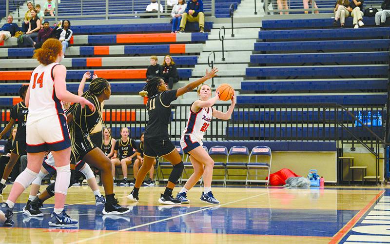 Lady Raiders senior Ahmia Roberts shoots around an East Hall defender. ZACH TAYLOR/Special