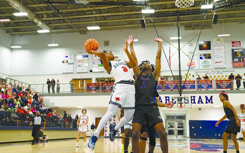Justus Gober fights his way to the rim in the season opener. ZACH TAYLOR/Special