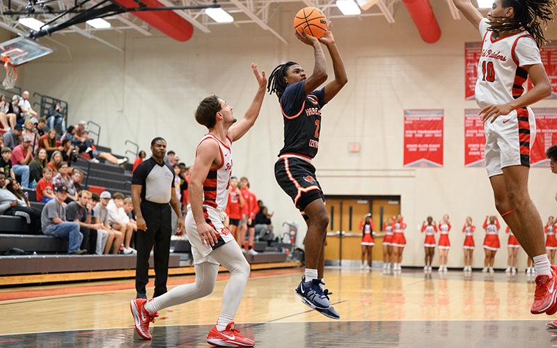 Habersham Central’s Enzo Combs floats over two Madison County defenders for two points. ZACH TAYLOR/Special