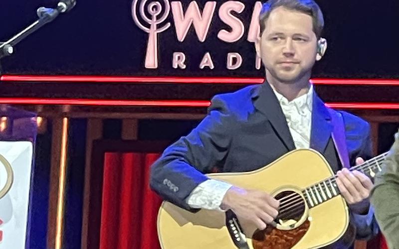 Clint Coker plays guitar at the Grand Ole Opry with bluegrass group Dailey &amp; Vincent on Nov. 26.  Coker is a Habersham County native and lives in Demorest where he teaches guitar lessons and travels with bluegrass groups. SUBMITTED