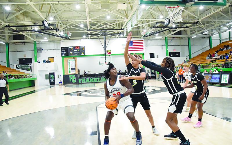 Habersham Central’s JoJo McCurry looks to work around multiple defenders inside against Greer. SHANE SCOGGINS/CNI News Service