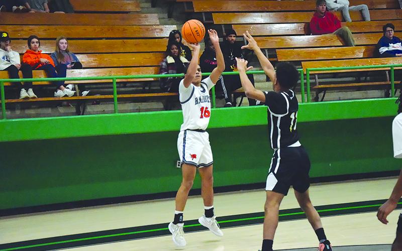 Habersham Central’s Jalen Davis fires a jumper from the corner. SHANE SCOGGINS/CNI News Service