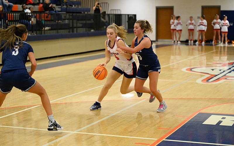 Sophie Bramlett dribbles through a White County defender. ZACH TAYLOR/Special