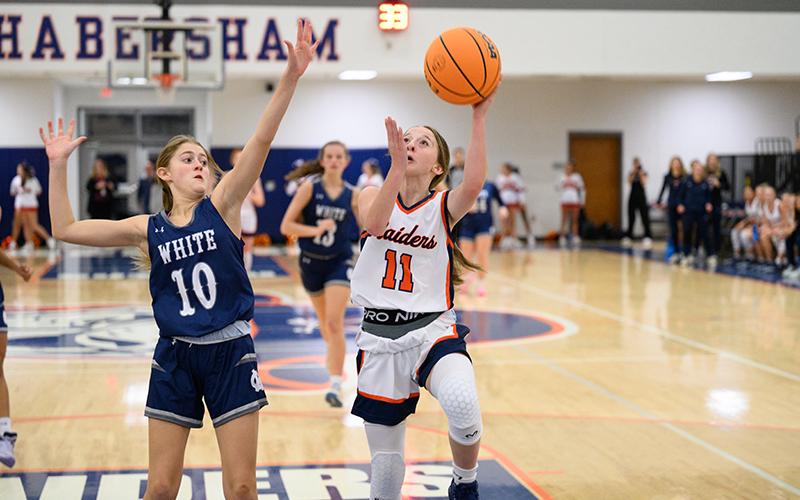 Kylie Littlejohn goes up for a layup while being heavily guarded. ZACH TAYLOR/Special