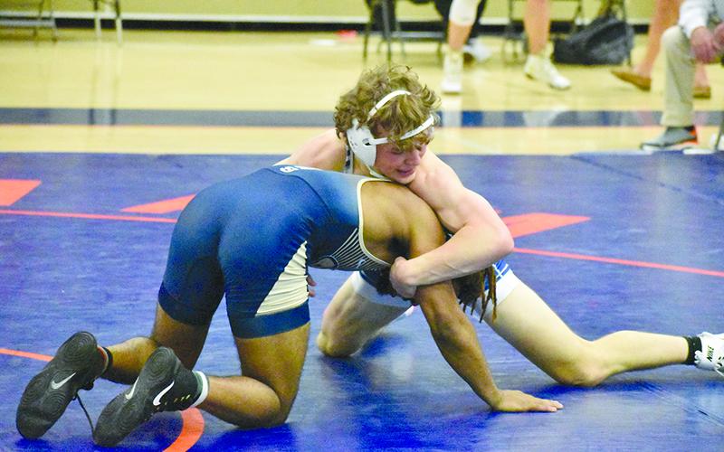 Habersham’s Jayden Garrison goes to work on his opponent on the way to a first-place finish in the 150-pound class. Habersham Central won its own wrestling tournament Saturday. MATTHEW OSBORNE/Staff