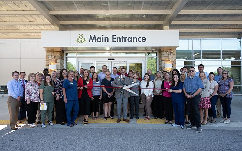 NGMC Vice President Kevin Matson ceremoniously cuts the ribbon in front of the main entrance of Northeast Georgia Medical Center - Habersham. ZACH TAYLOR/Special