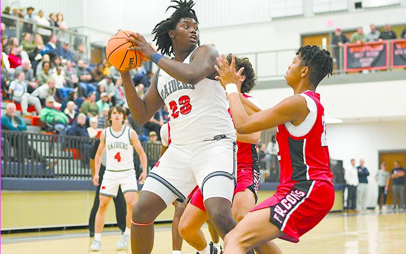 JoJo McCurry begins to drive toward the net in the Flowery Branch matchup. TOM ASKEW/Special