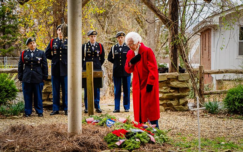 The Tomochici Chapter of the National Society Daughters of the American Revolution hosted a Wreaths Across America event at the Old Clarkesville Cemetery on Dec. 16. Shown is Anne Purcell after placing a wreath in honor of POW/MIA military personnel. Anne Purcell is the widow of the late Col. Ben Purcell, who was the highest-ranking U.S. Army officer held as a prisoner of war during the Vietnam War. CARSON SPRINKLE/Special
