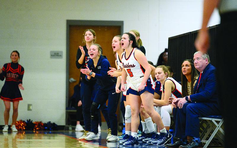 Oaklee Jackson (5) leads the way as the Lady Raiders’ bench supports their teammates on the floor during a recent win. ZACH TAYLOR/Special