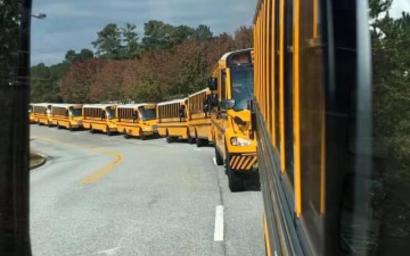 Habersham County School buses lineup to pick up students. SUBMITTED