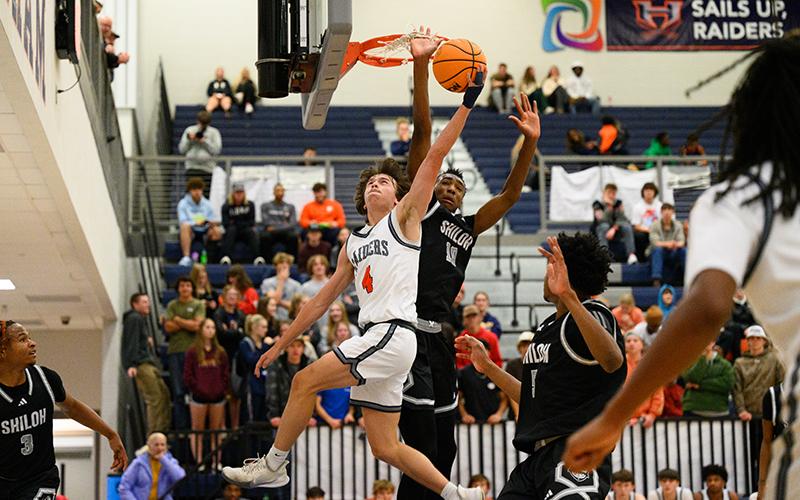 Shiloh’s Tylis Jordan gets his hand caught in the net trying to block Habersham Central’s Brannon Gaines during Wednesday’s game. ZACH TAYLOR/Special