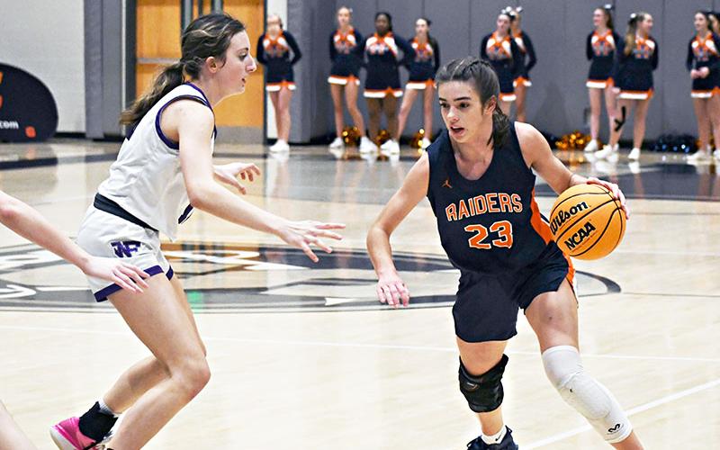 Habersham Central's Kyia Barrett (right) looks to drive past a North Forsyth defender on Friday night. LANG STOREY/Staff