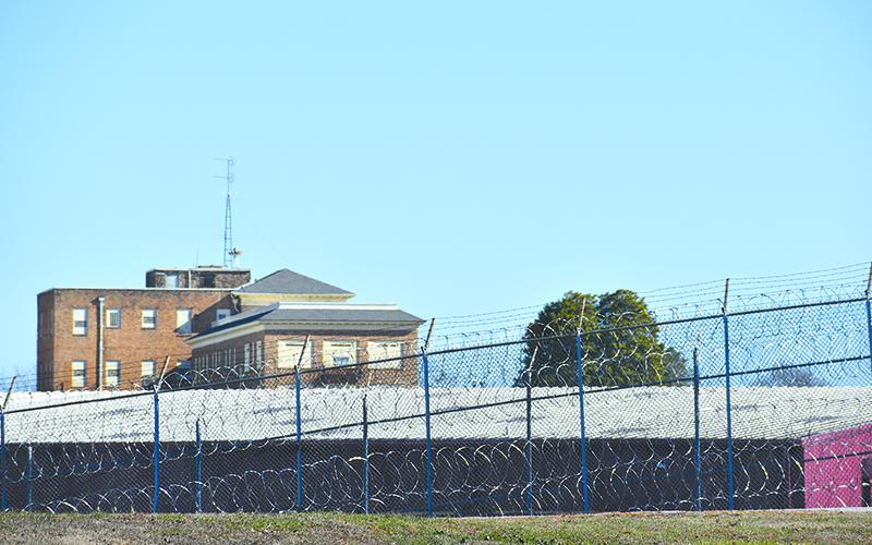Lee Arrendale State Prison had a large contingent of law enforecement vehicles come in, but a spokseman denied they were moving the inmates out. MATTHEW OSBORNE/Staff