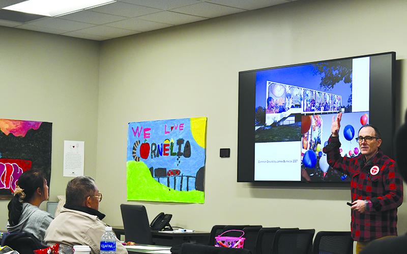 Philadelphia artist David McShane teaches community members about the process of murals. JULIANNE AKERS/Staff
