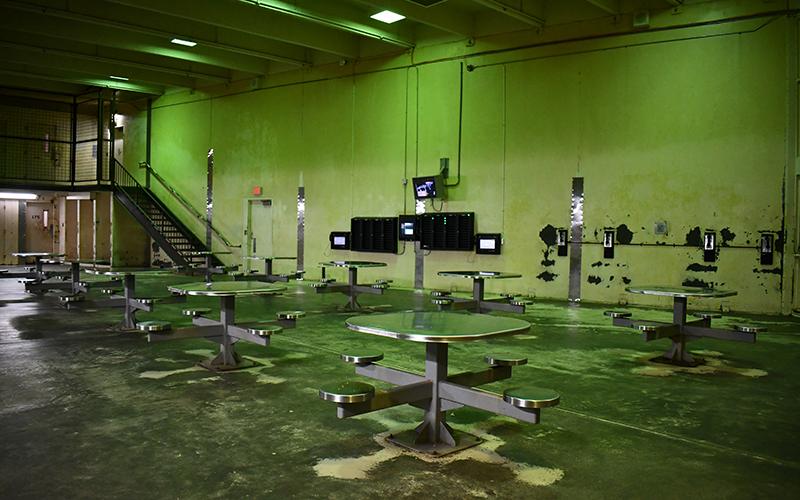 Shown is the day area of a block at the Habersham County jail where inmates can make phone calls, use tablets to take rehabilitation courses, or socialize. JULIANNE AKERS/Staff