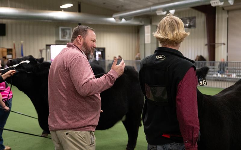 Robert Bollier (left) gives some pointers to Luke Bryson during the show. ZACH TAYLOR/Special